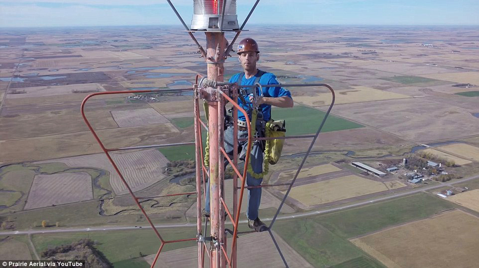 Drone Video of a Person Taking a Selfie at 1500 Ft. Tower